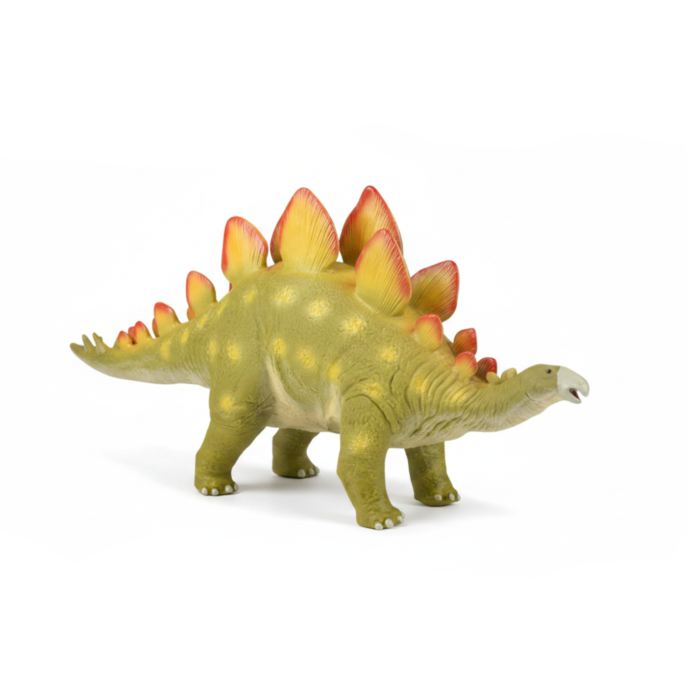 Toy Stegosaurus dinosaur on a white background