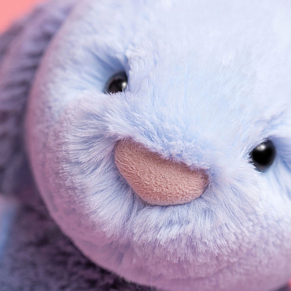 showing a plush Puddlesea Bunny toy with a close-up of its face.