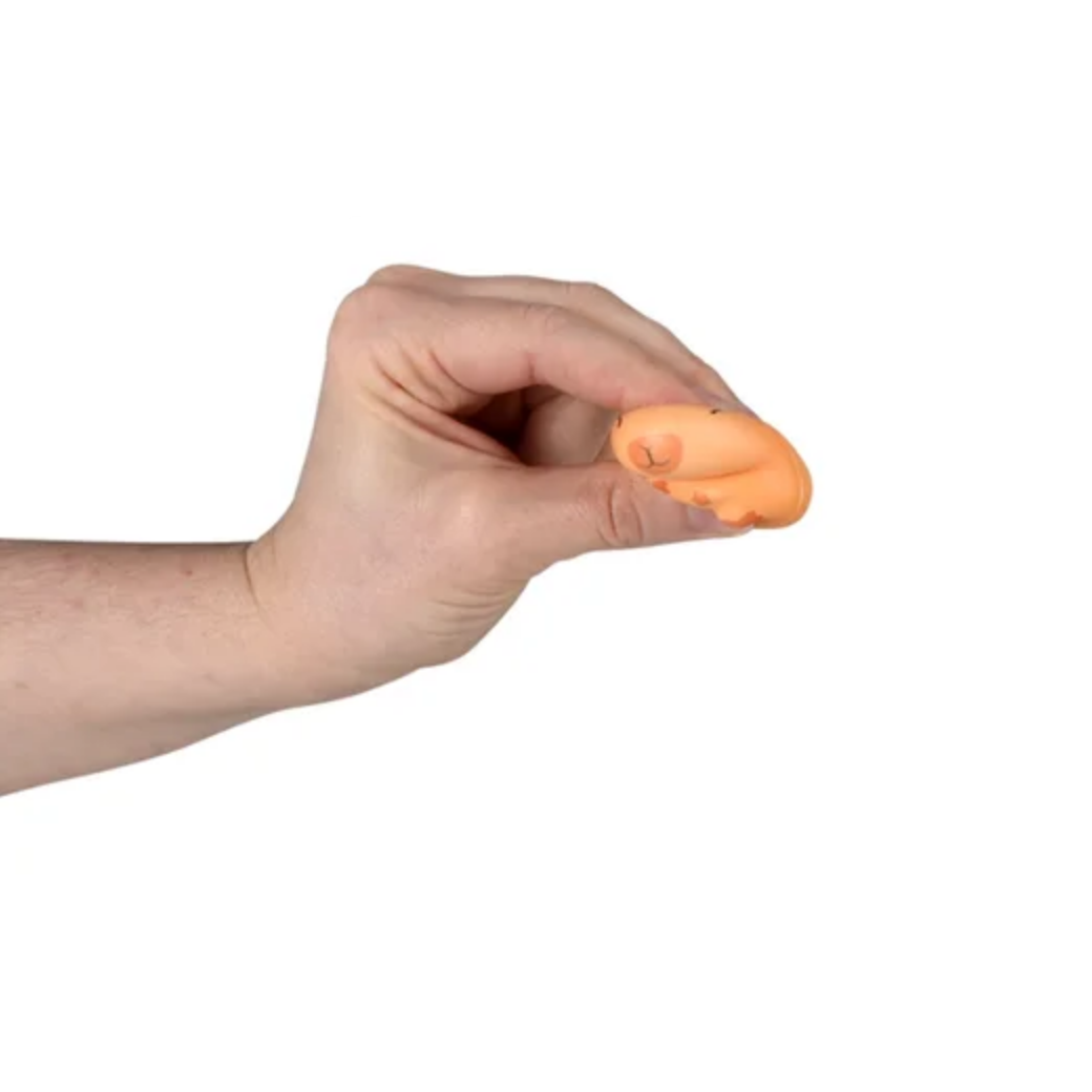 Hand holding an orange earplug against a white background