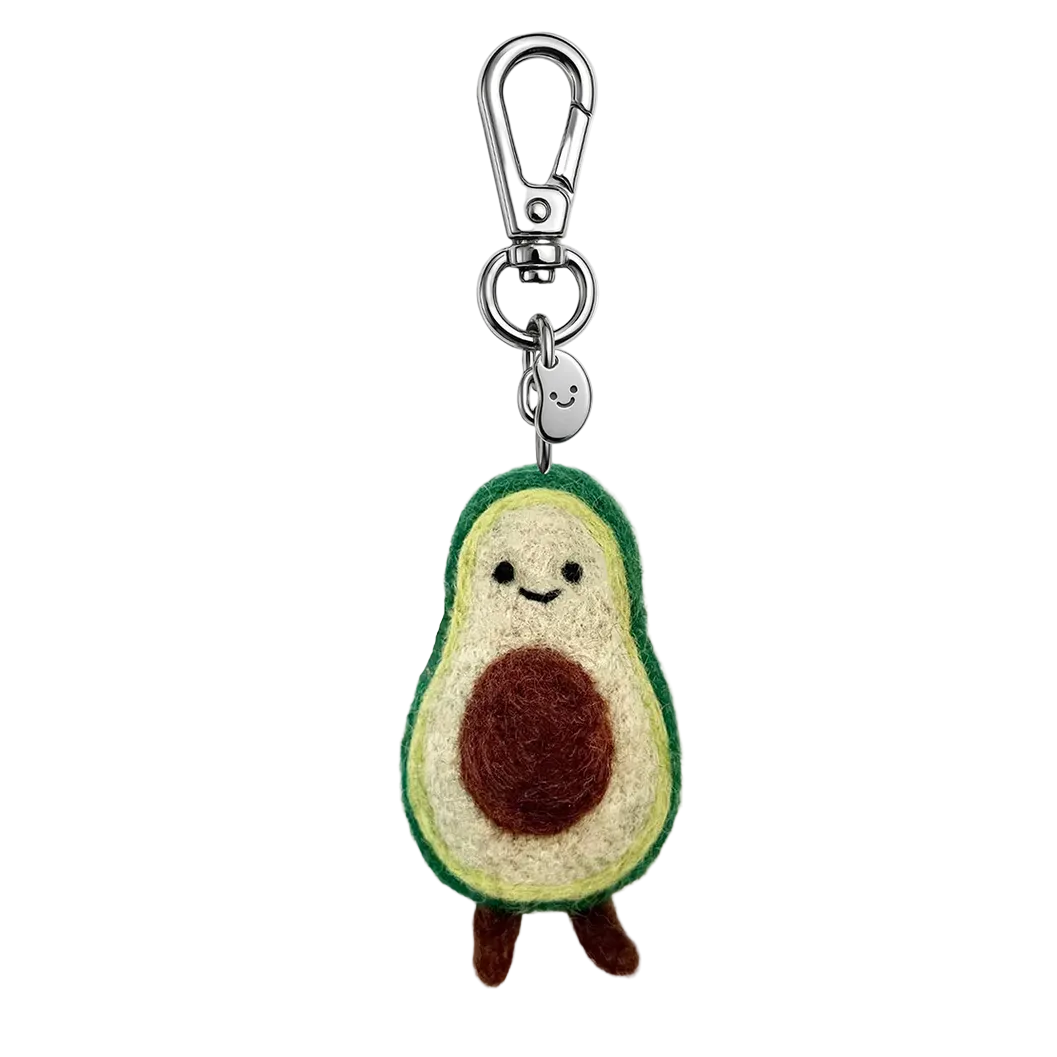 Avocado-shaped keychain with a smiling face on a white background