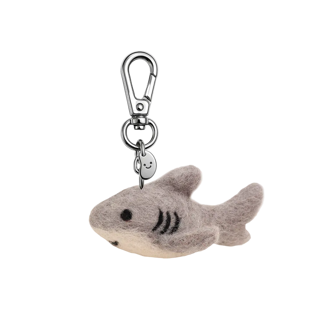 Plush shark keychain with a metal clip on a white background