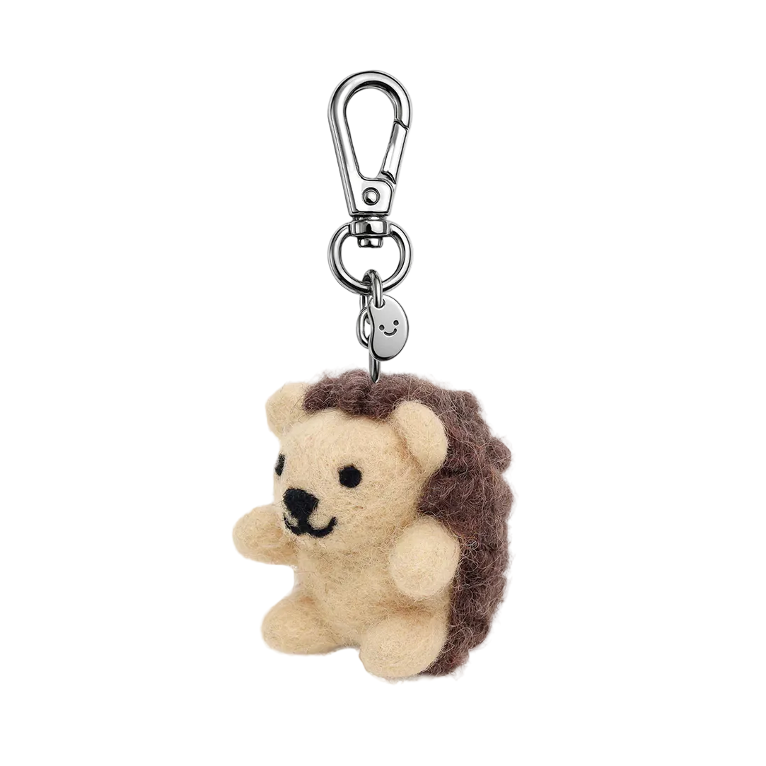 Hedgehog-shaped keychain with a carabiner on a white background