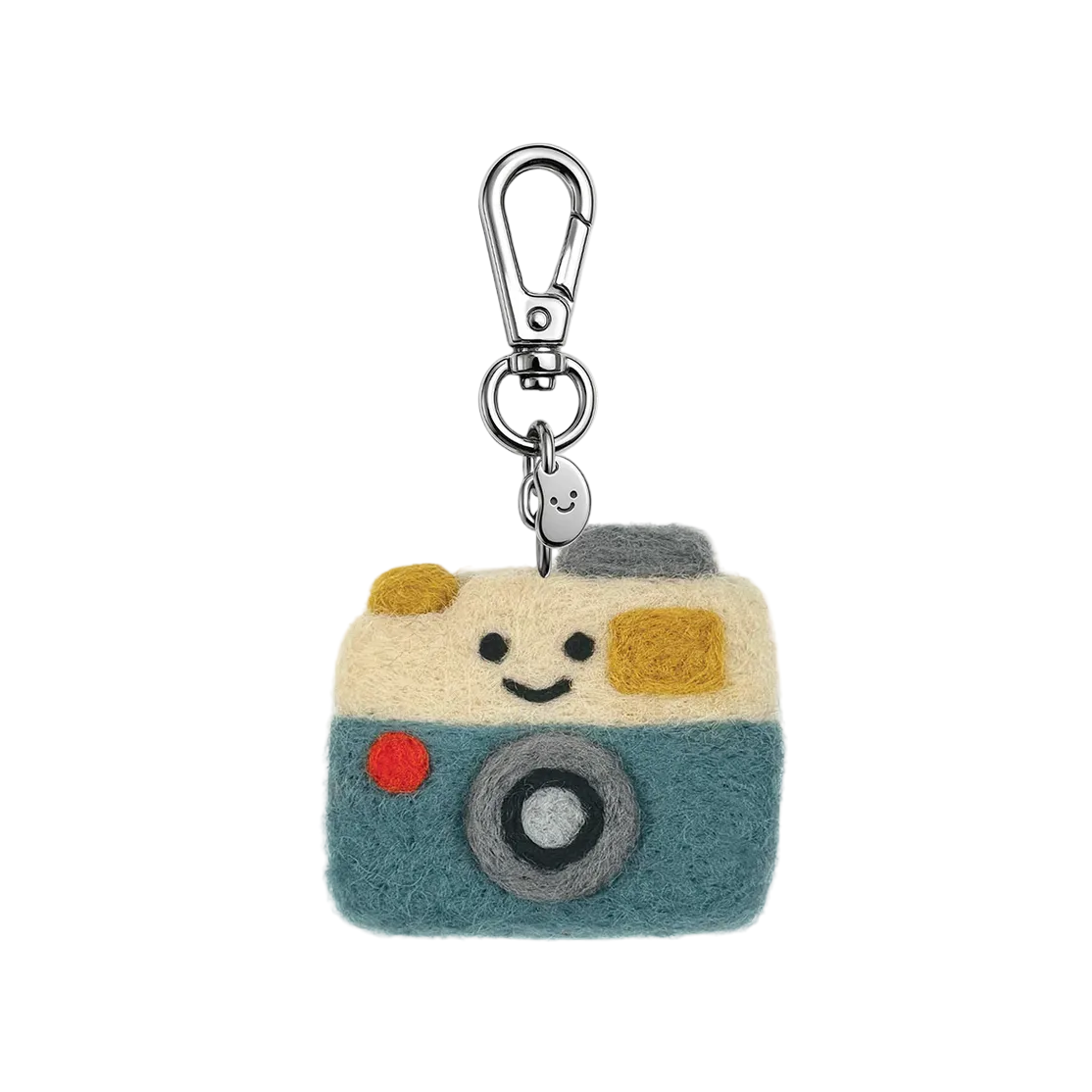 Camera-shaped keychain with a smiling face on a white background