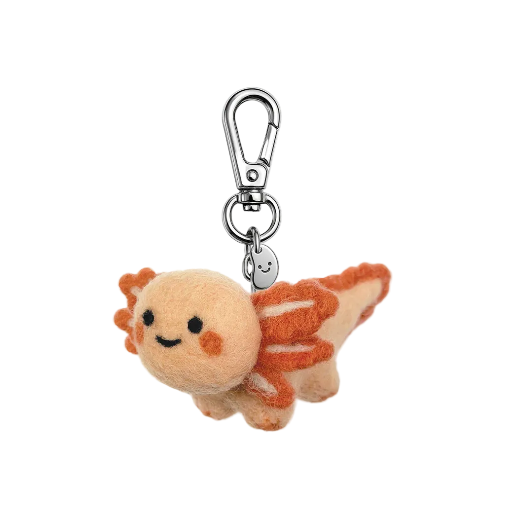 Plush keychain with a smiling face on a white background