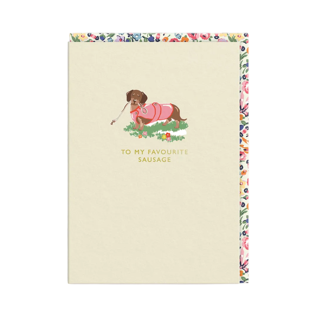 Card with a dog illustration and text 'To my favourite sausage' on a floral border.