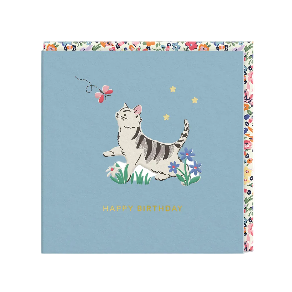 Birthday card with a cat illustration on a blue background