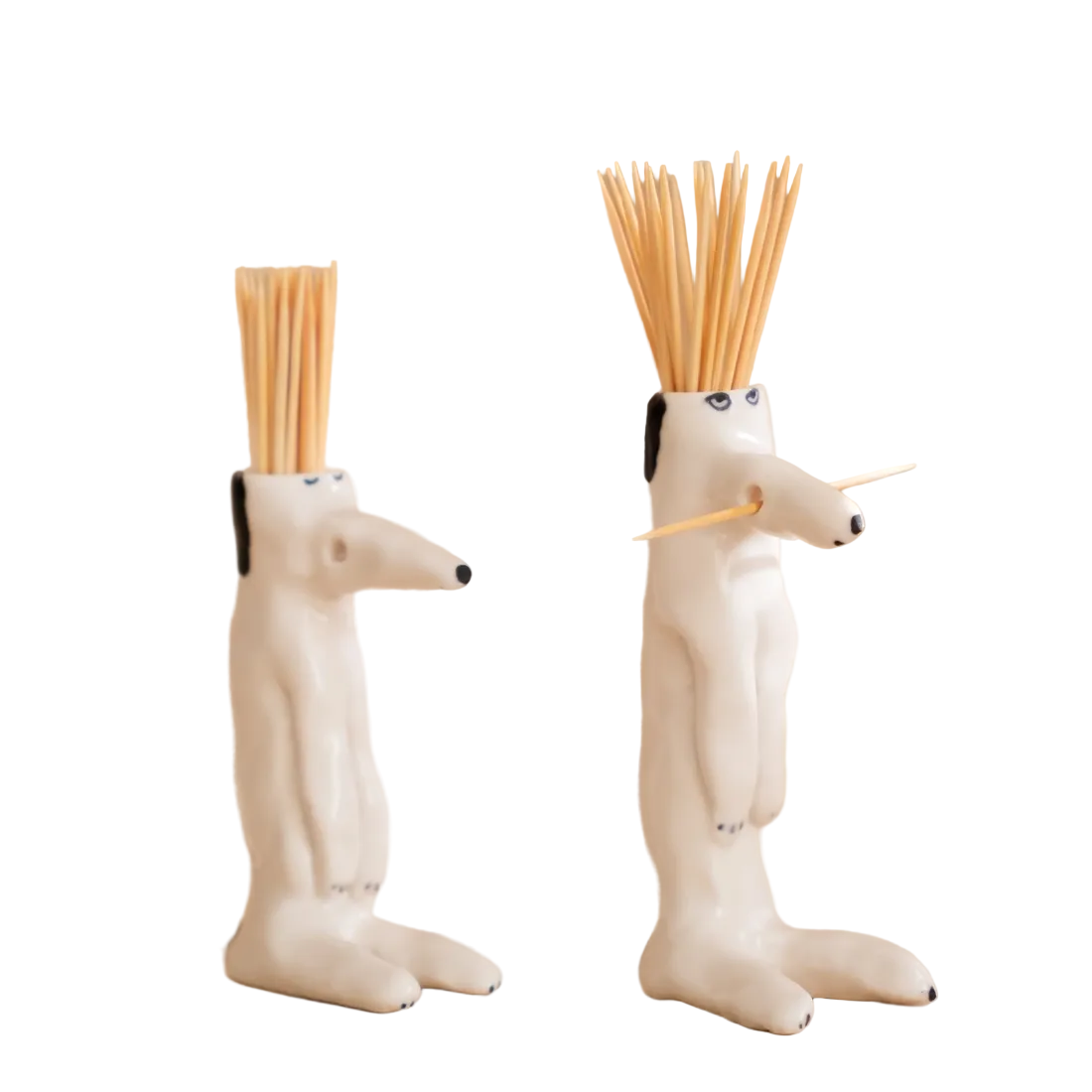 Two dog-shaped toothpick holders with toothpicks 