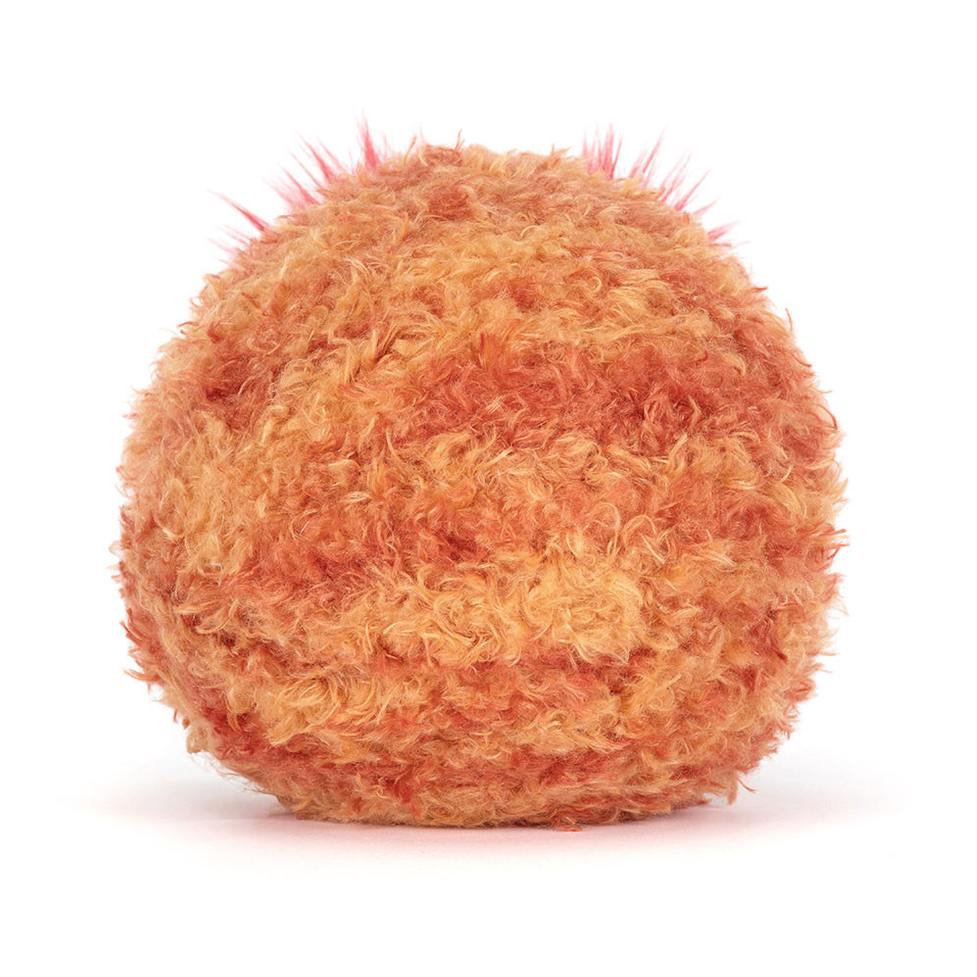 Round, textured object resembling a planet on a white background 