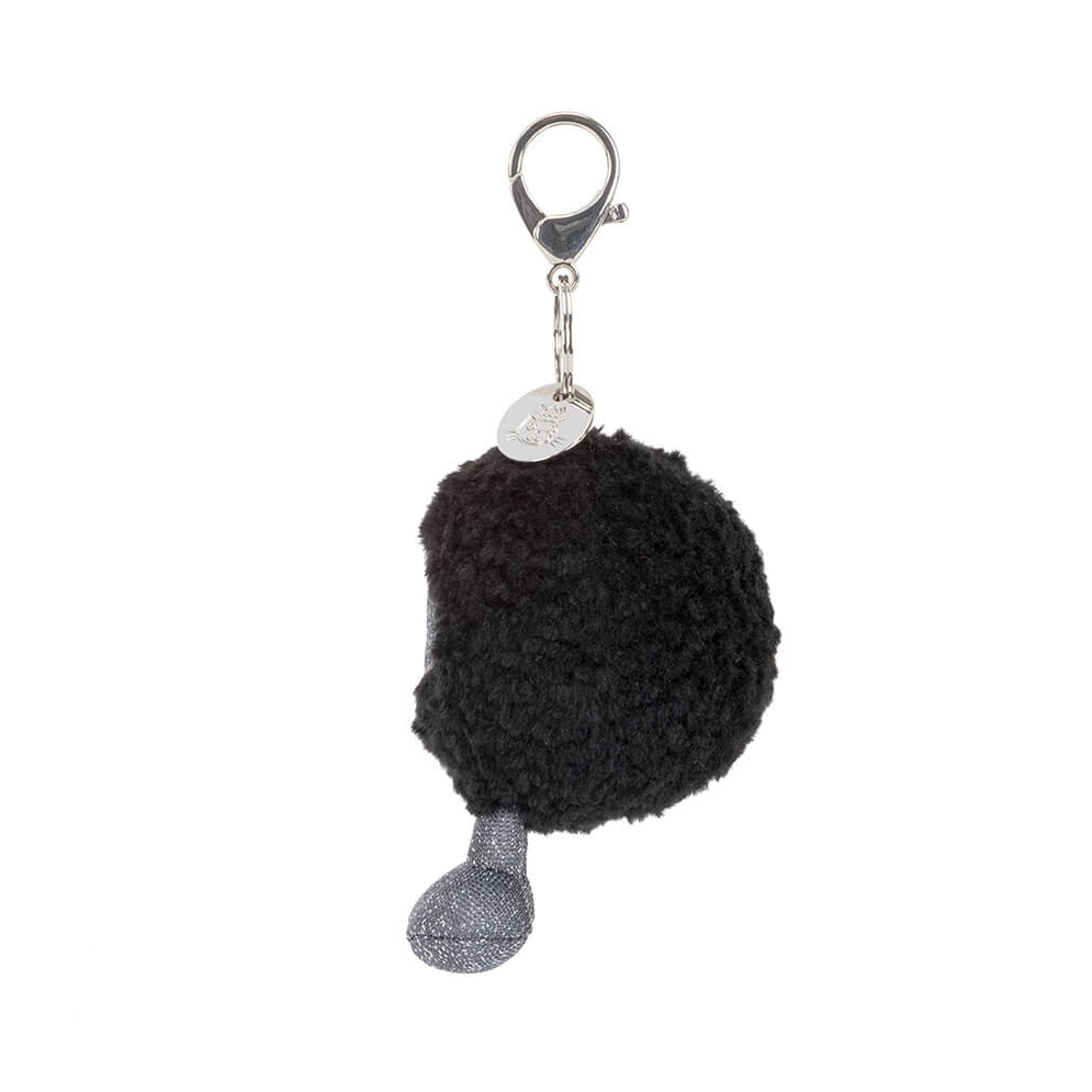 Black hole bag charm with a keychain on a white background