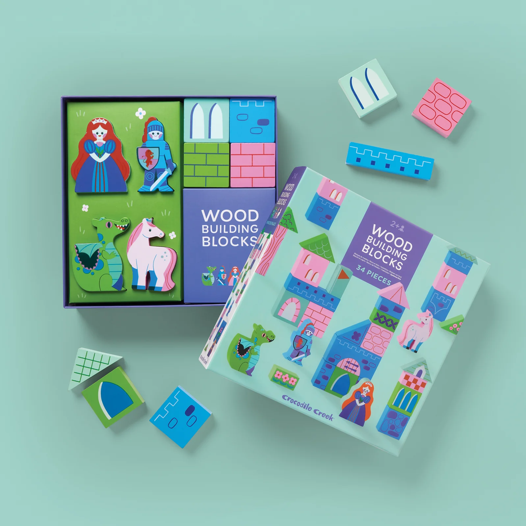 Wood building blocks set with colorful packaging on a light blue background