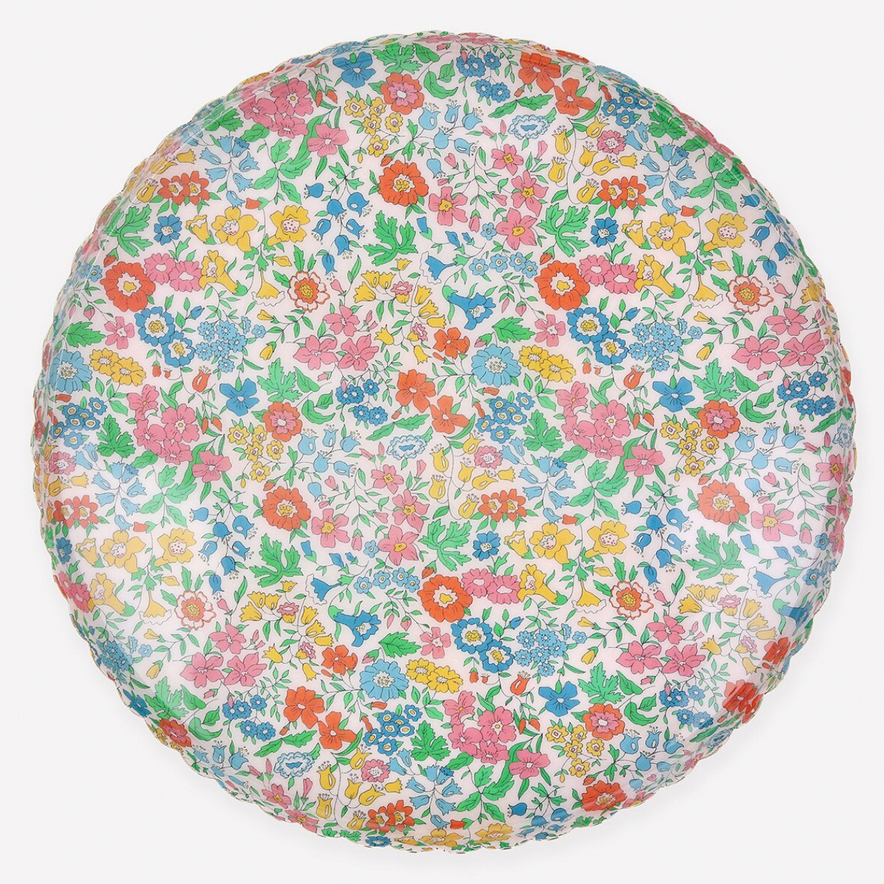 Round cushion with a colorful floral pattern on a white background