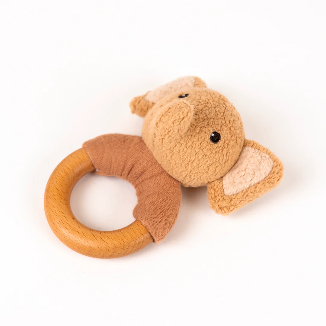 Plush monkey rattle toy on a white background