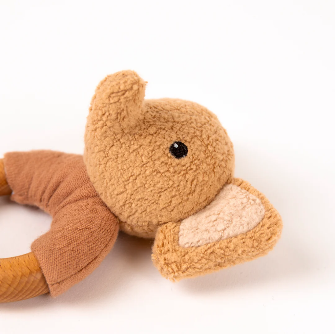 Brown plush toy on a white background
