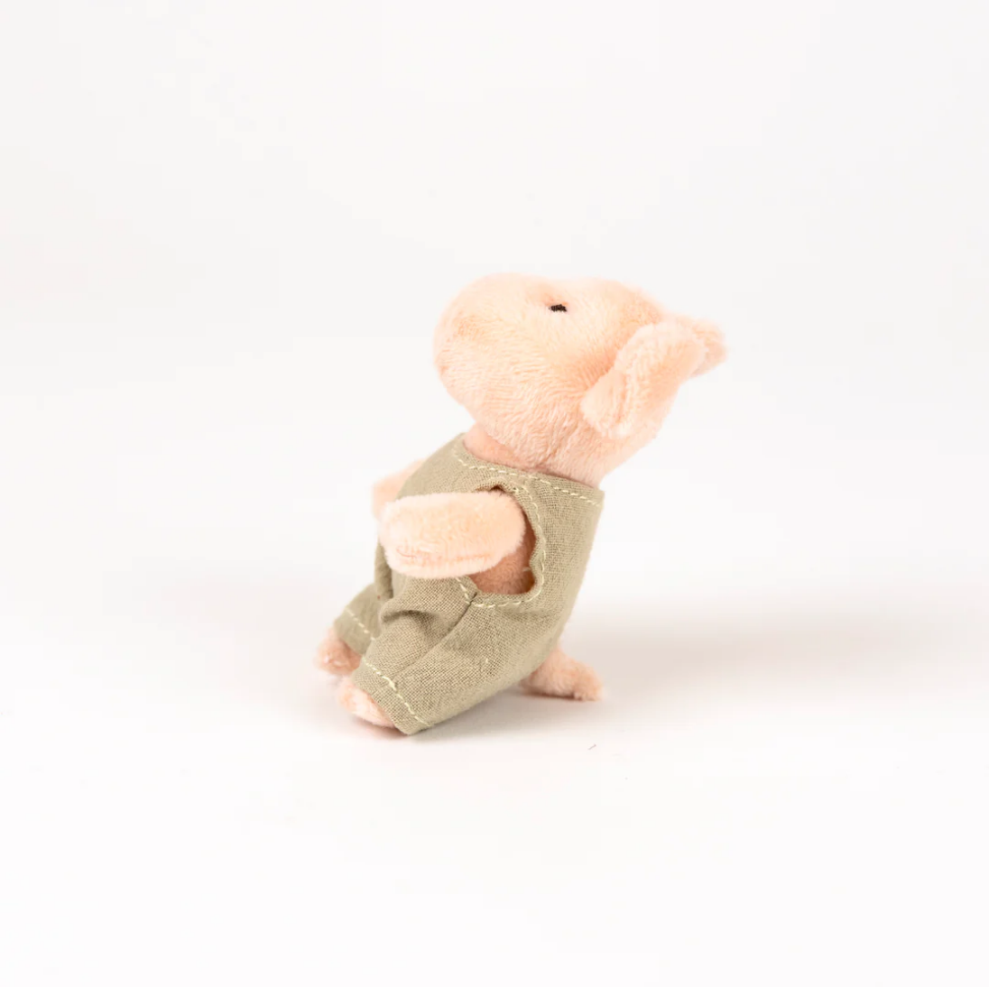 Plush toy mouse in a green outfit on a white background