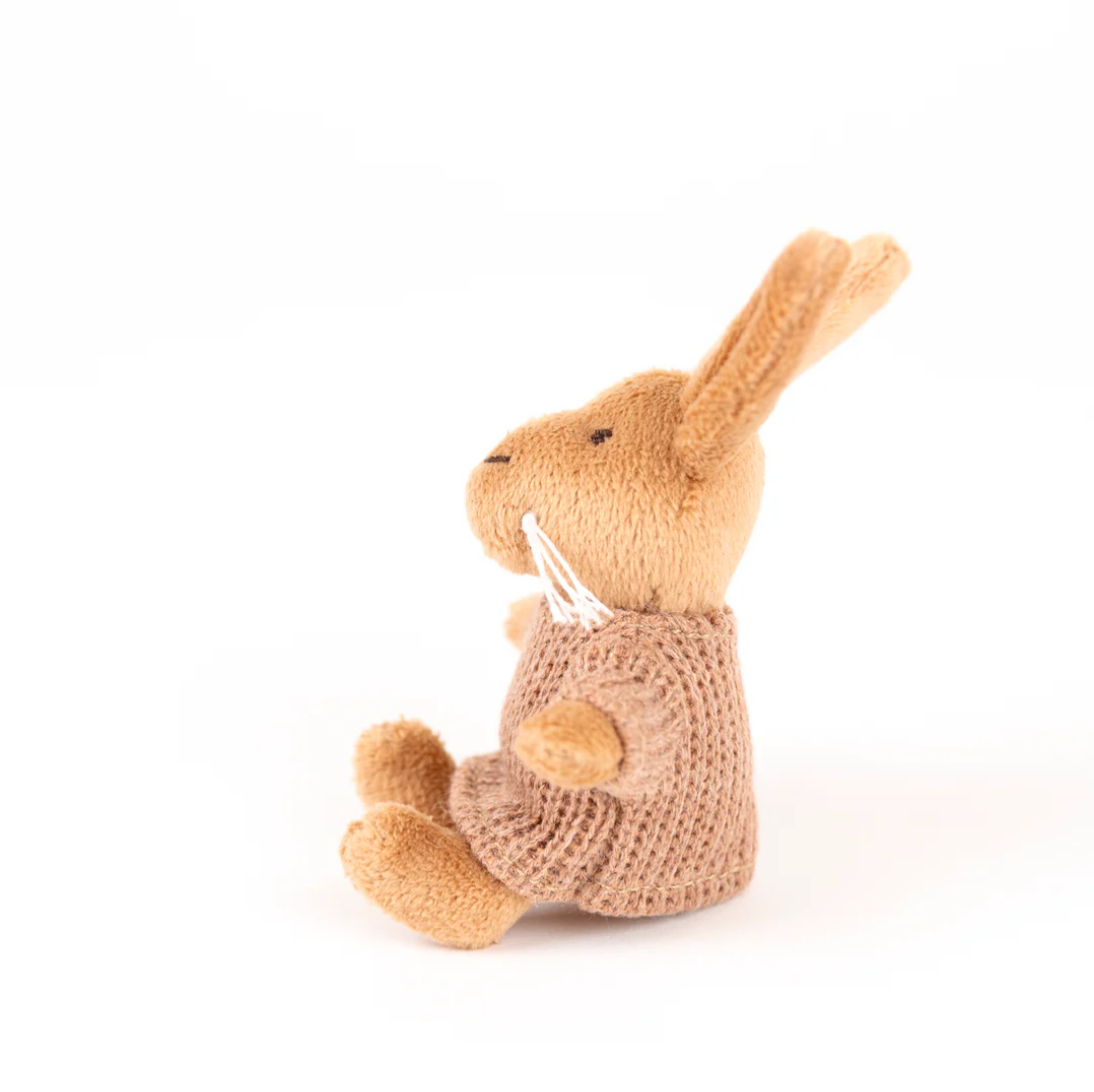 Knitted toy rabbit on a white background