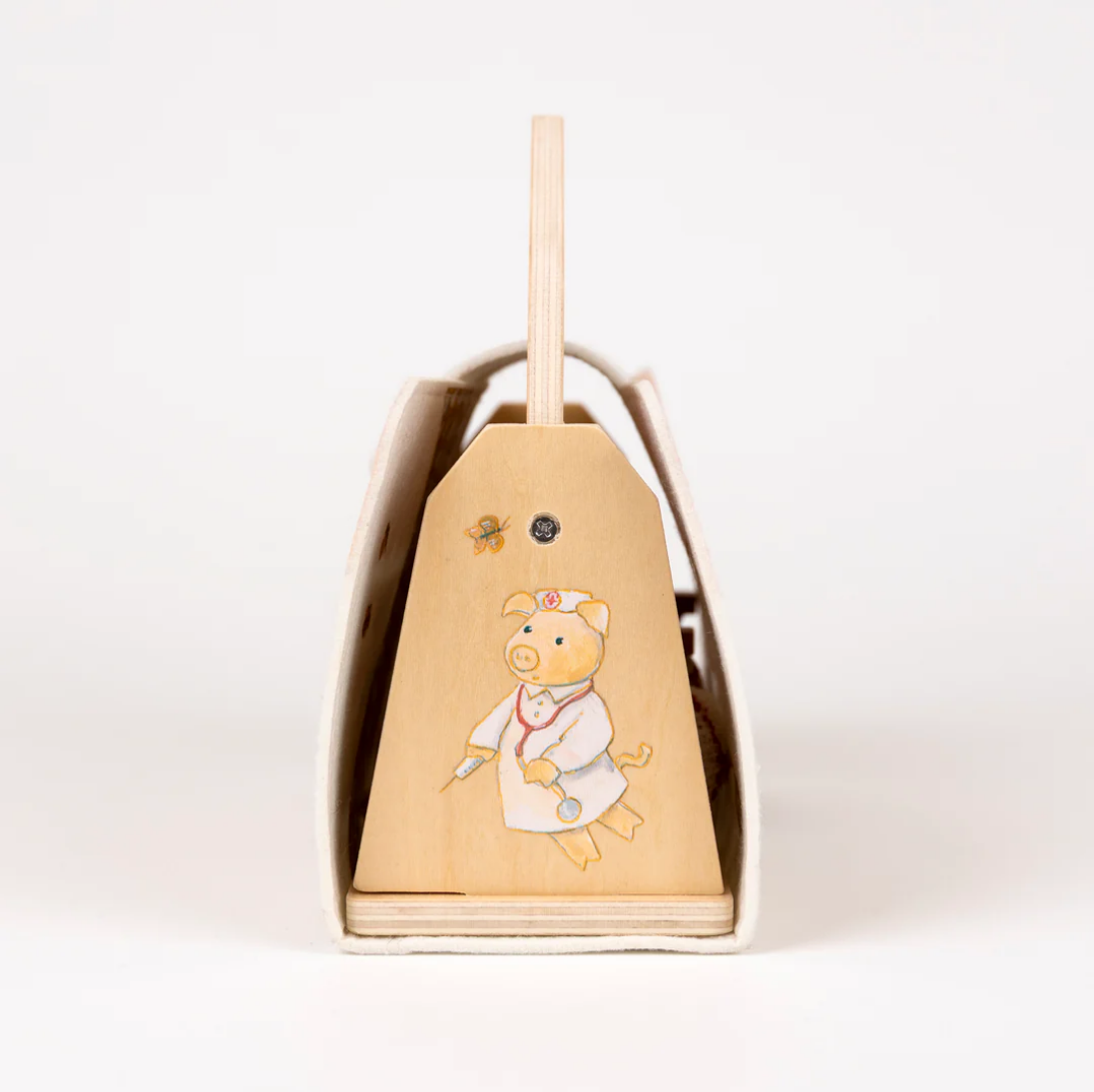 Wooden dollhouse with cartoon pig design on a white background