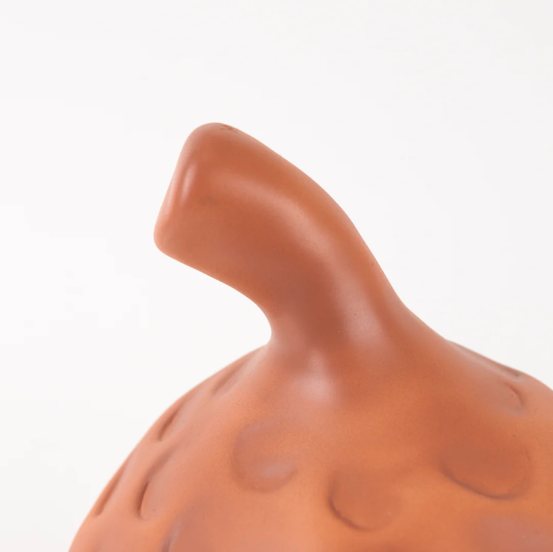 Terracotta-colored lap on a white background