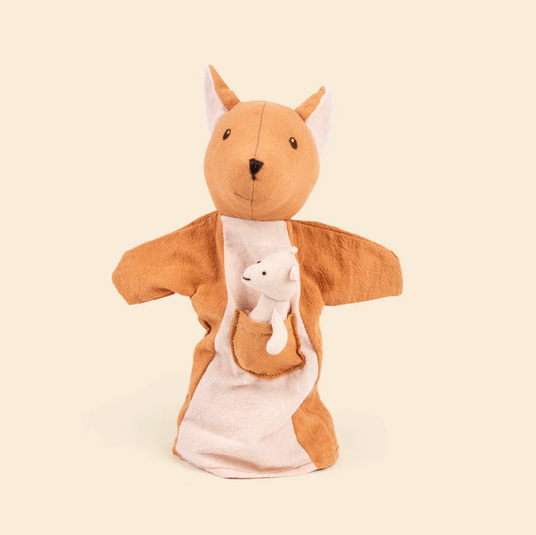 Plush toy kangaroo with a smaller plush baby inside on a beige background