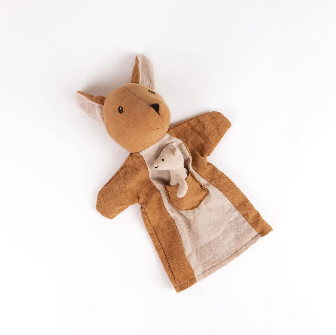 Brown plush toy with a white interior on a white background