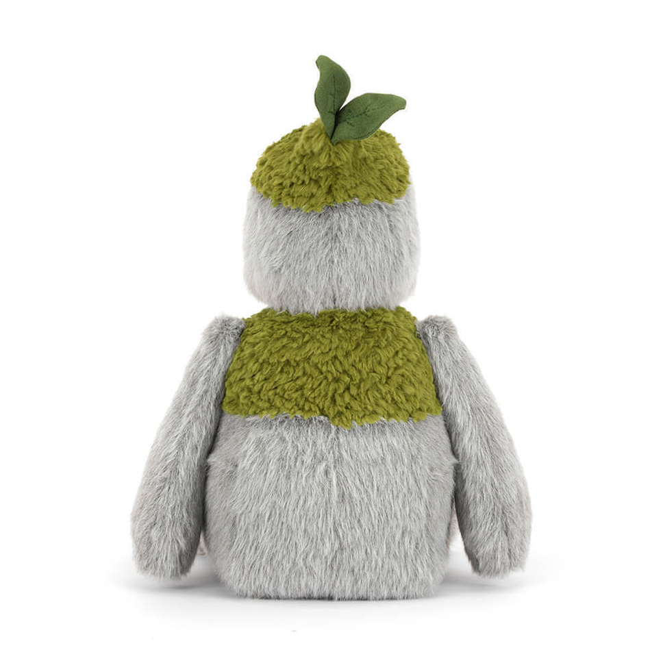 Stuffed toy resembling a rock creature with a green scarf and hat on a white background