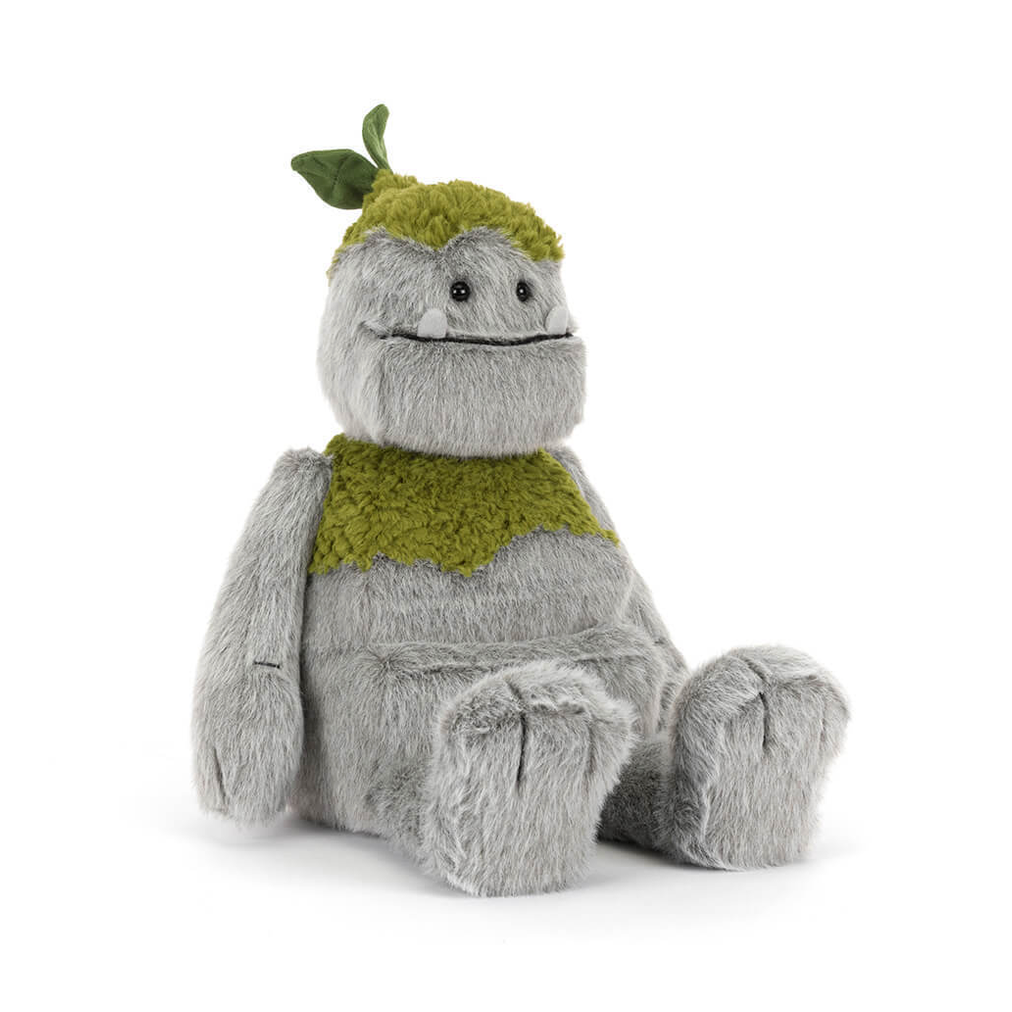 Plush toy resembling a creature with a green top and gray body on a white background