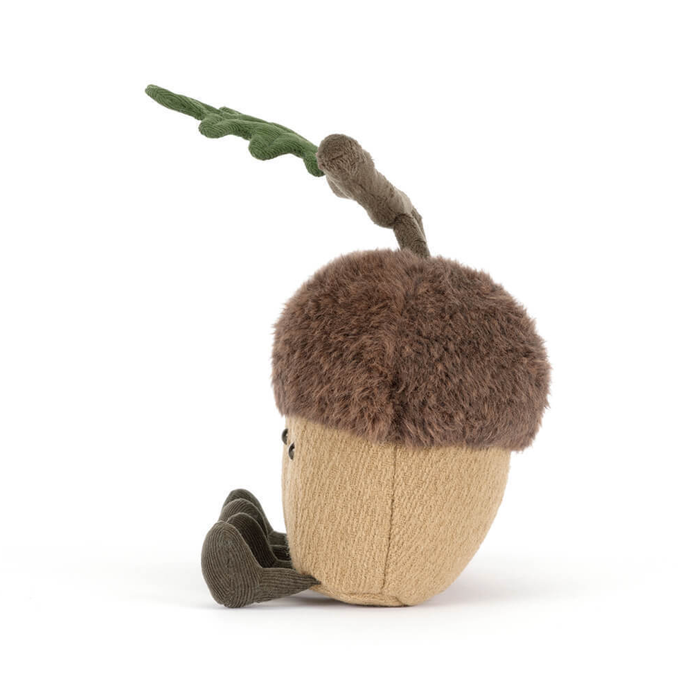 Plush toy shaped like an acorn with a stem on a white background