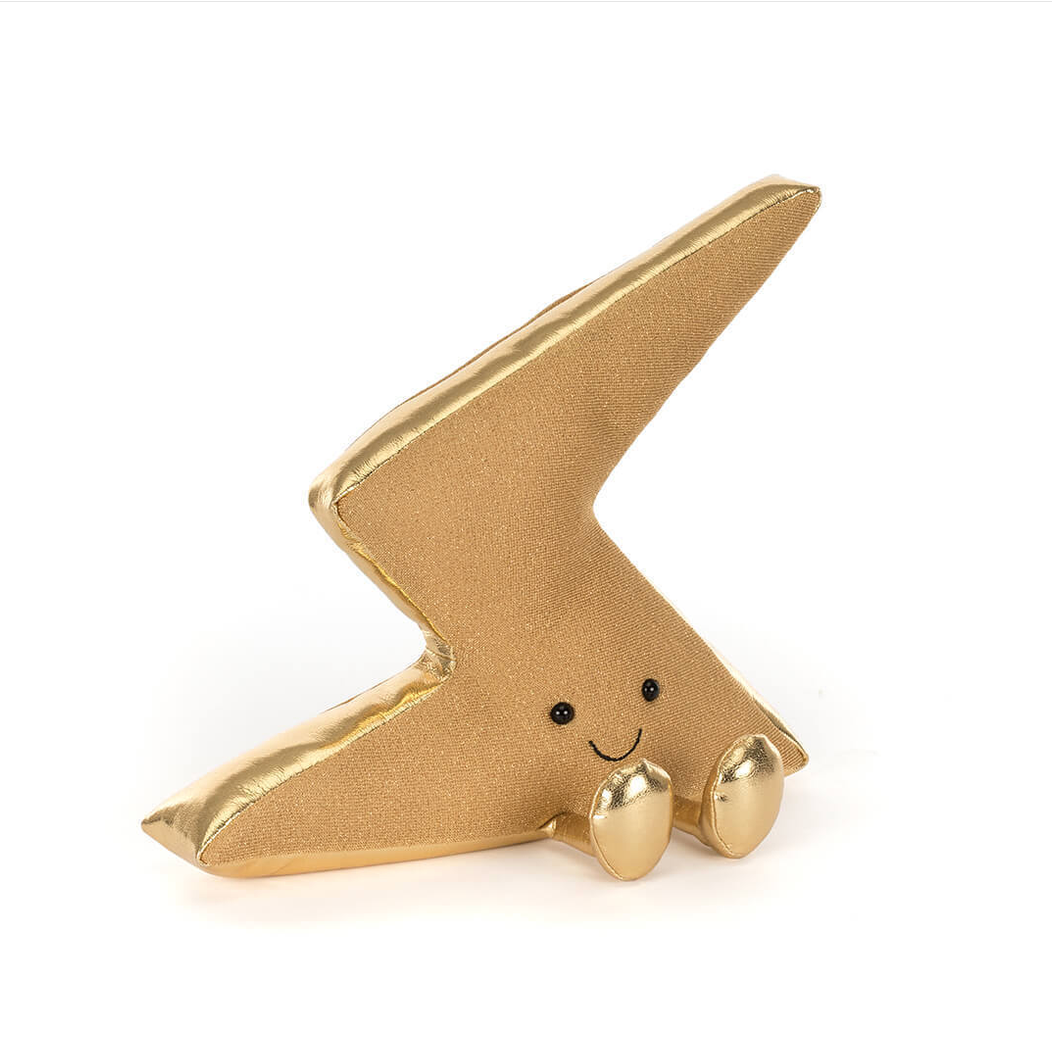 Gold lightning bolt-shaped figurine with a smiling face on a white background