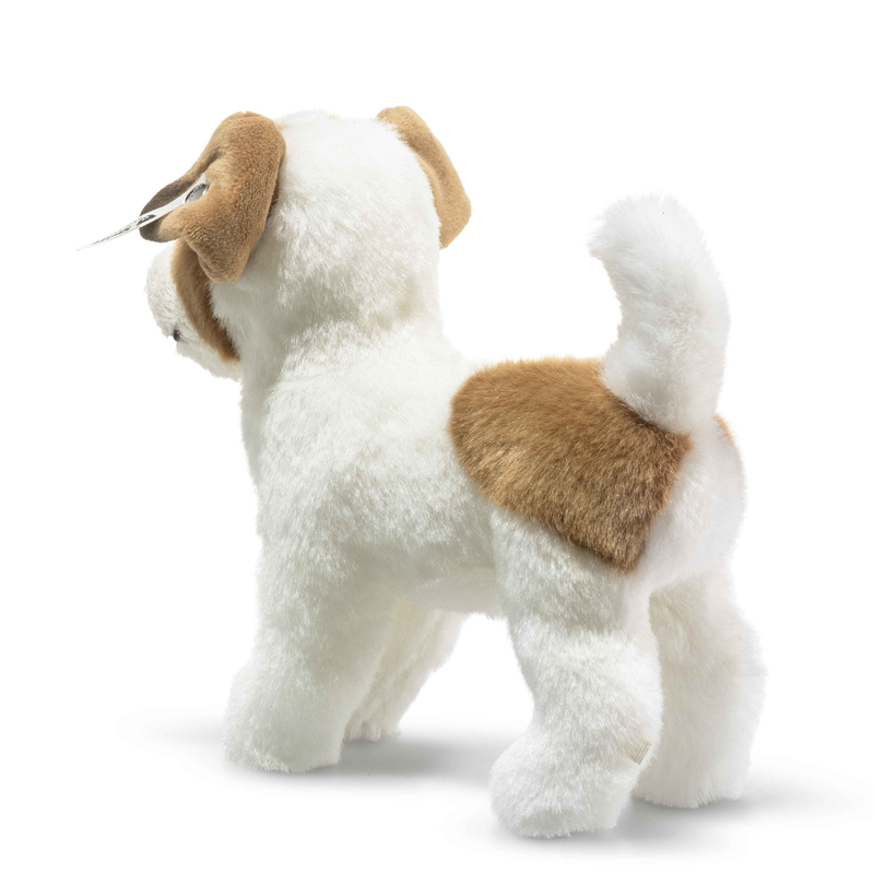 Plush toy dog with brown and white fur on a white background