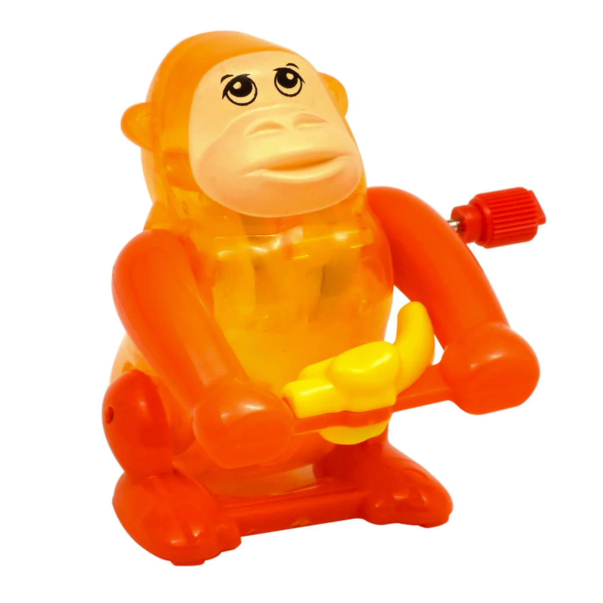 Toy monkey with a banana on a white background
