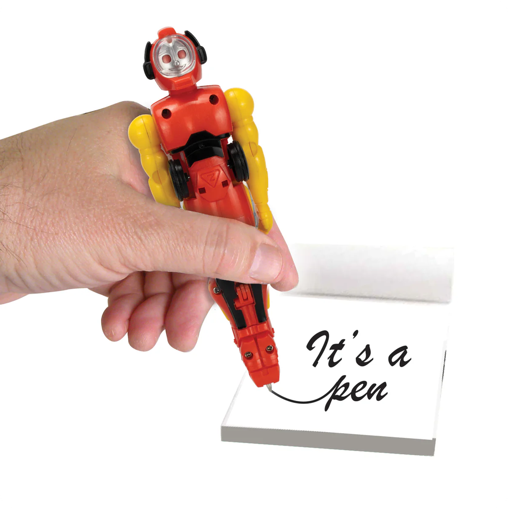 Toy robot pen being used to write 'It's a pen' on a piece of paper.