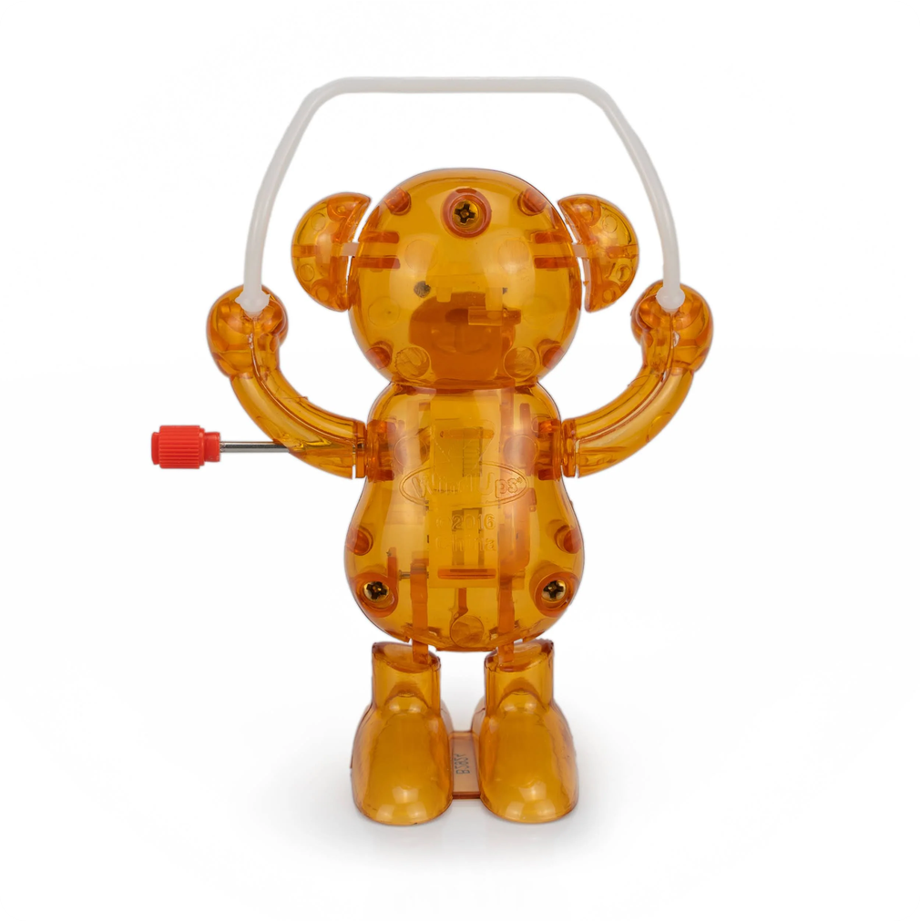 Transparent orange bear toy with a white background