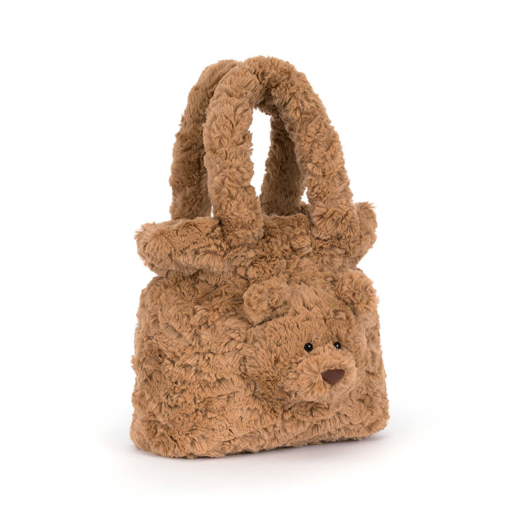 A brown teddy bear-shaped handbag with long handles, shown on a white background 