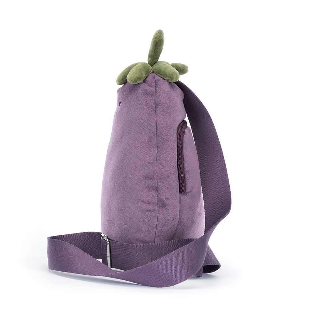 A purple aubergine-shaped crossbody bag with a plush green aubergine topper and a wide adjustable strap, shown on a white background with a text label at the bottom.