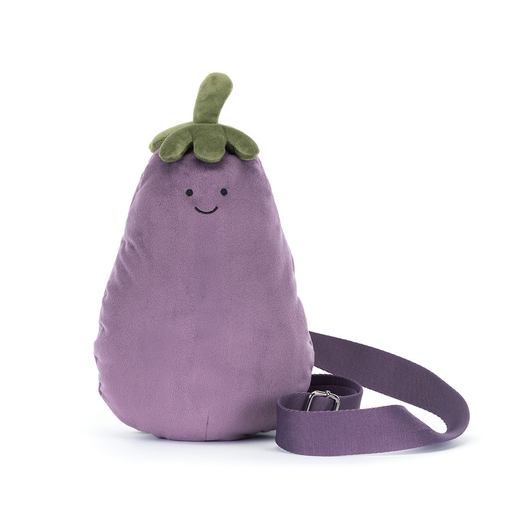 A purple egg-shaped plush crossbody bag with a green top and a smiling face, shown on a plain white background with its strap coiled in front.