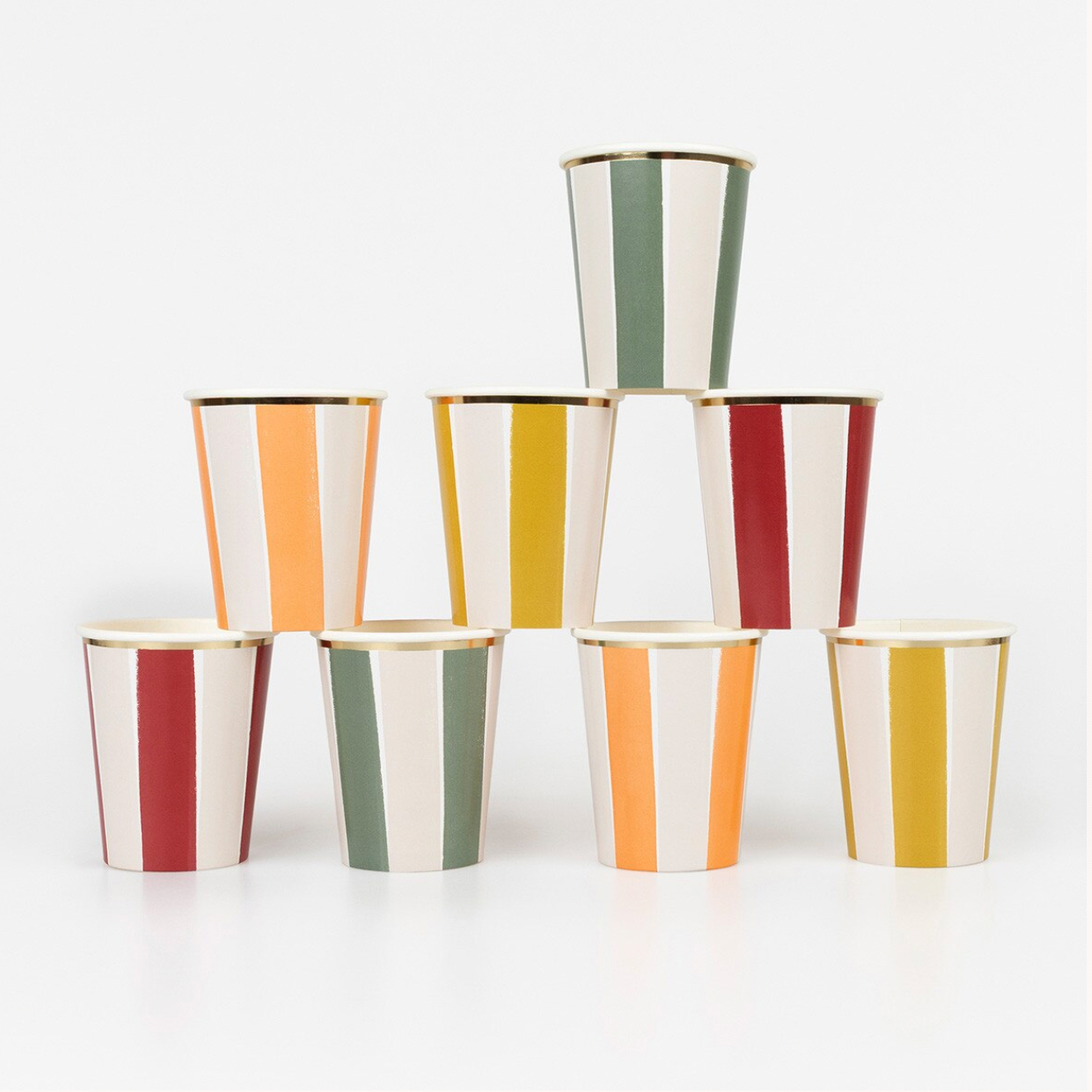 A set of eight paper party cups with vertical stripes in red, orange, yellow, green, and white, finished with a gold rim, arranged in a pyramid stack on a white background.