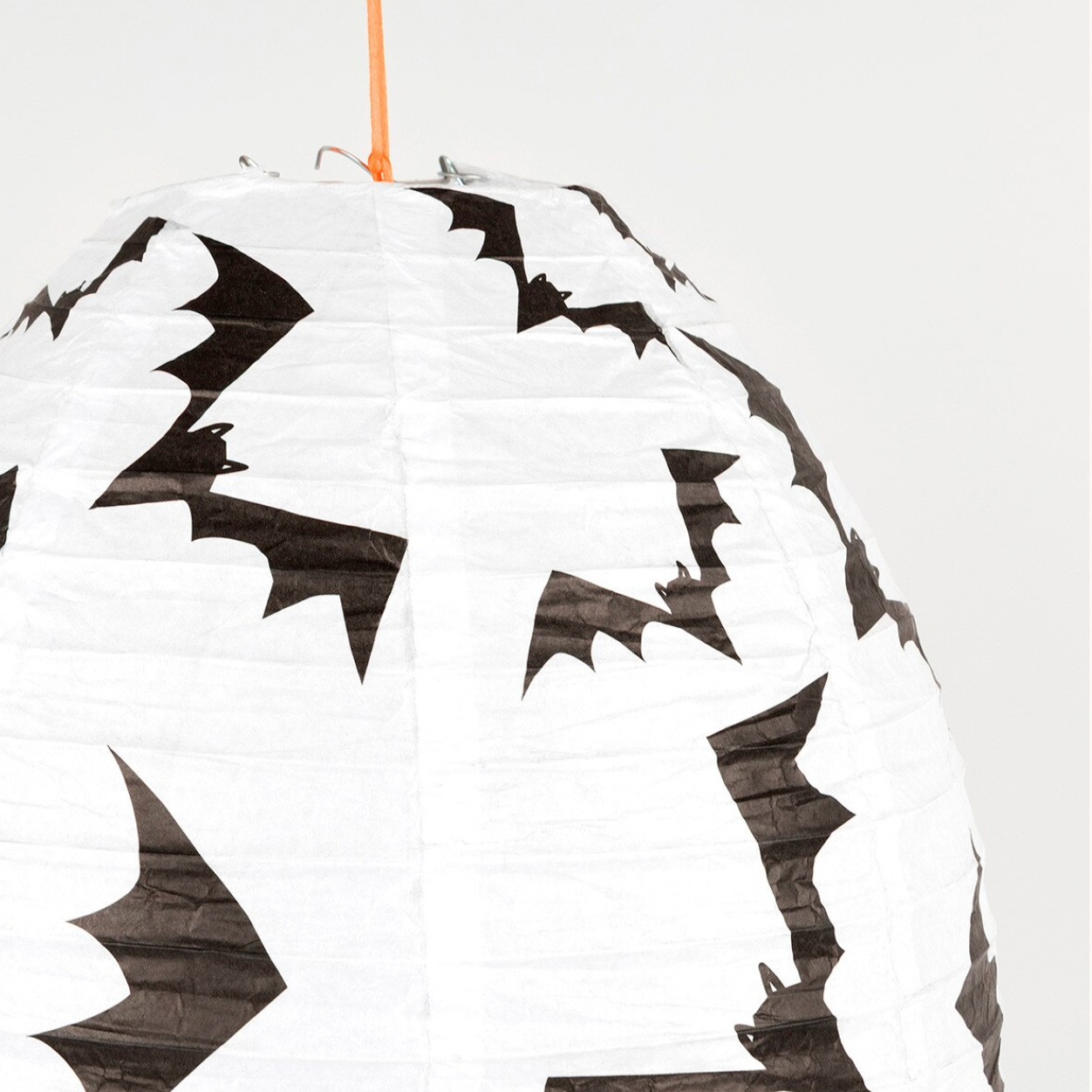 A white paper lantern decorated with black bat silhouettes, shown against a light gray background with a product info sidebar visible on the right.
