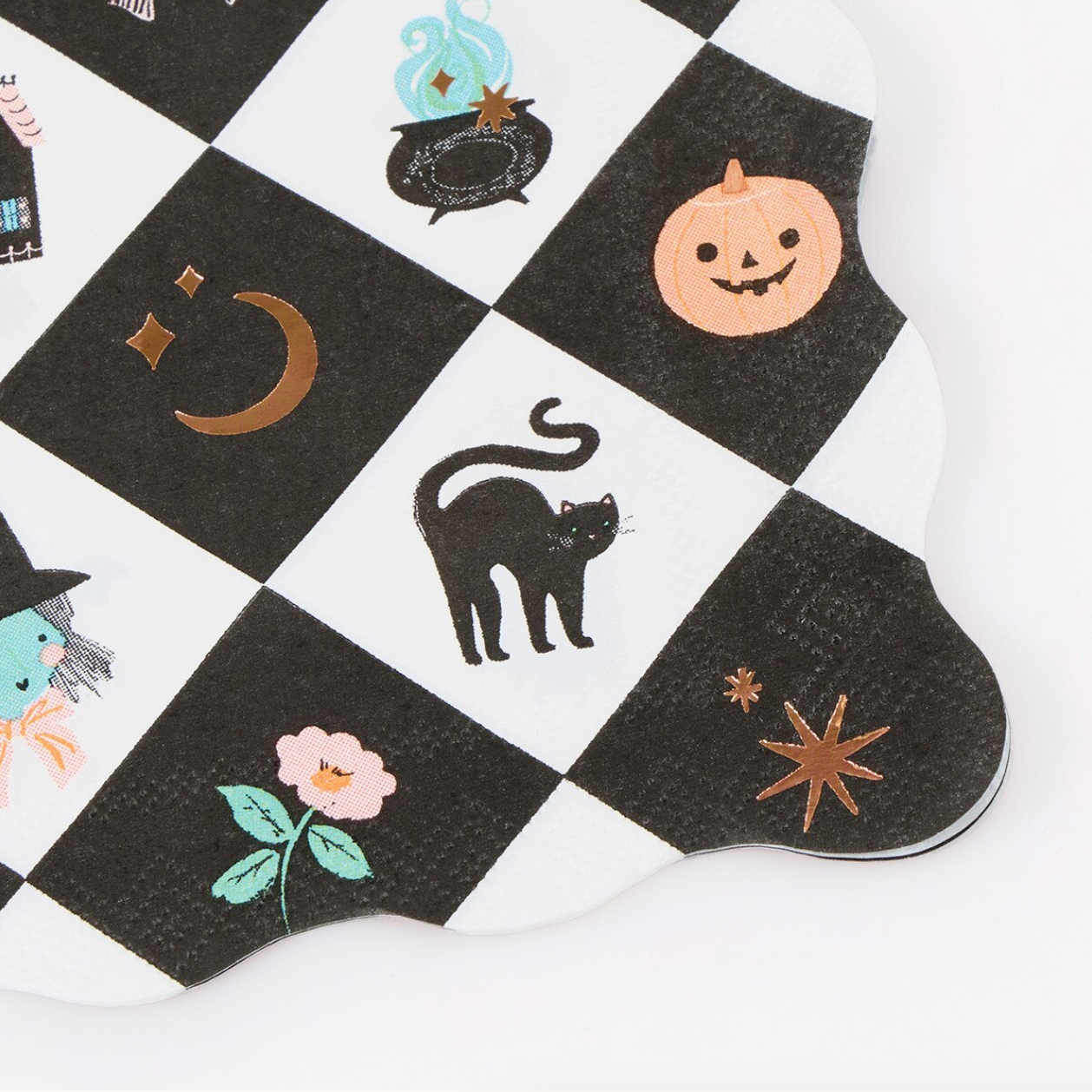 A Halloween-themed paper napkin with a black and white checkered pattern featuring illustrations of a jack-o'-lantern, black cat, witch, flower, cauldron, and stars.