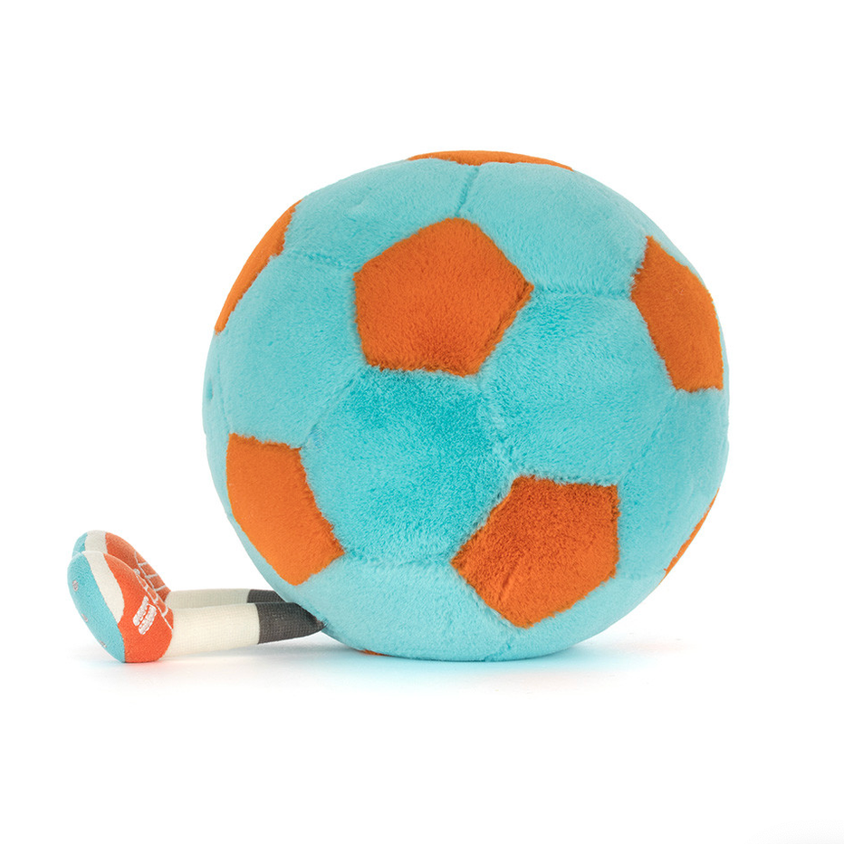 A plush jellycat soccer ball toy with light blue and orange panels.