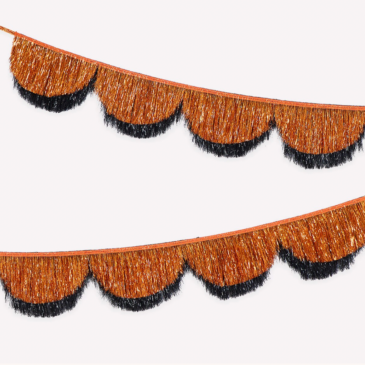 Two strands of decorative fringe garland with scalloped edges, featuring a metallic bronze-brown top layer and black tinsel fringe underneath, shown on a plain white background.