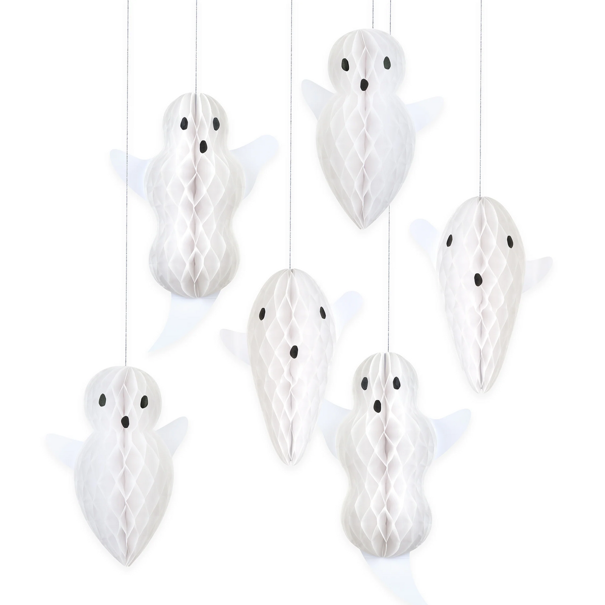 Six white hanging ghost decorations made of honeycomb paper, each with small black eyes and mouths, suspended against a plain white background.