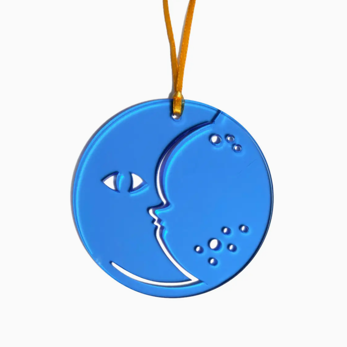 A blue circular hanging ornament featuring a crescent moon and star design, suspended from a yellow string against a plain white background.