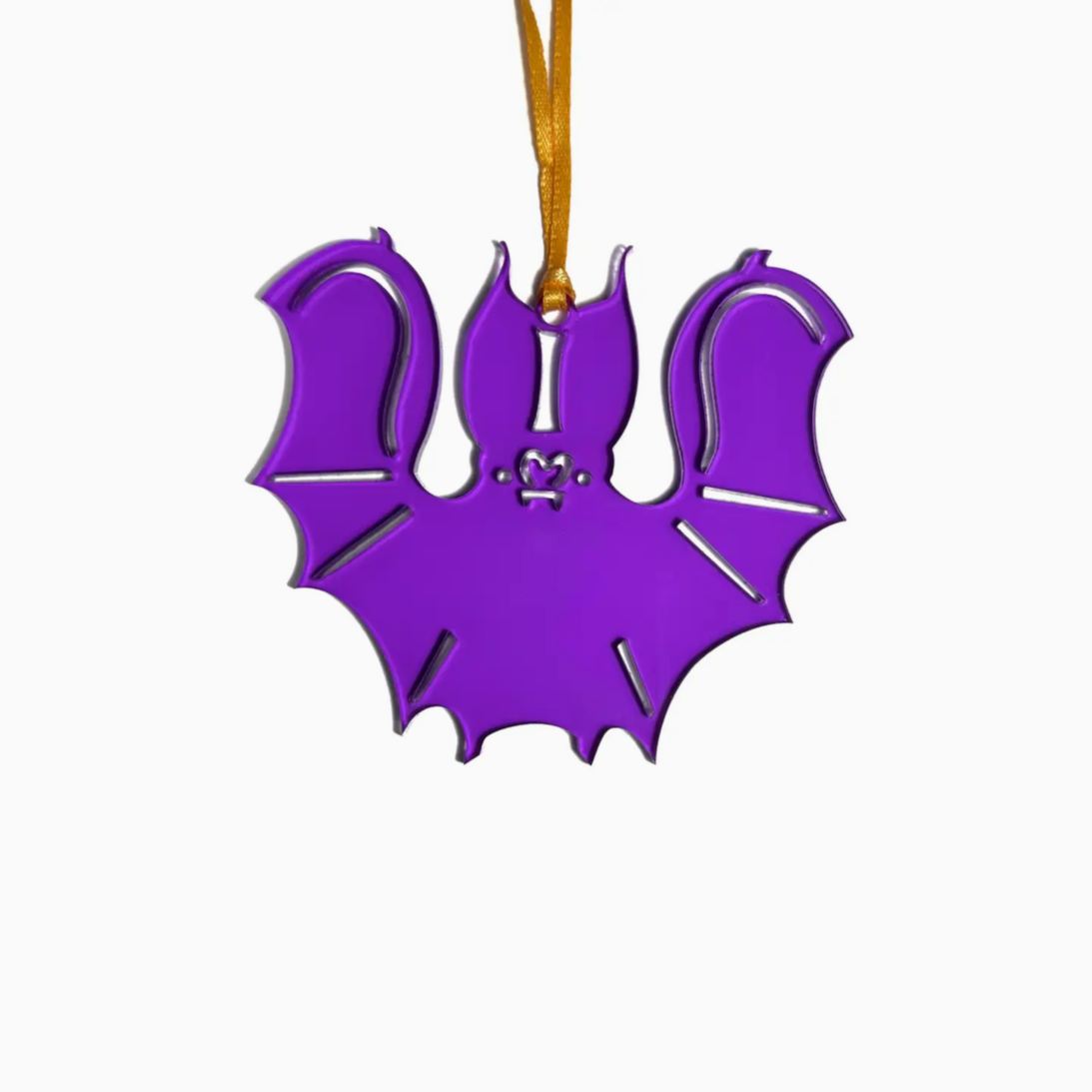 Purple bat-shaped ornament on a white background