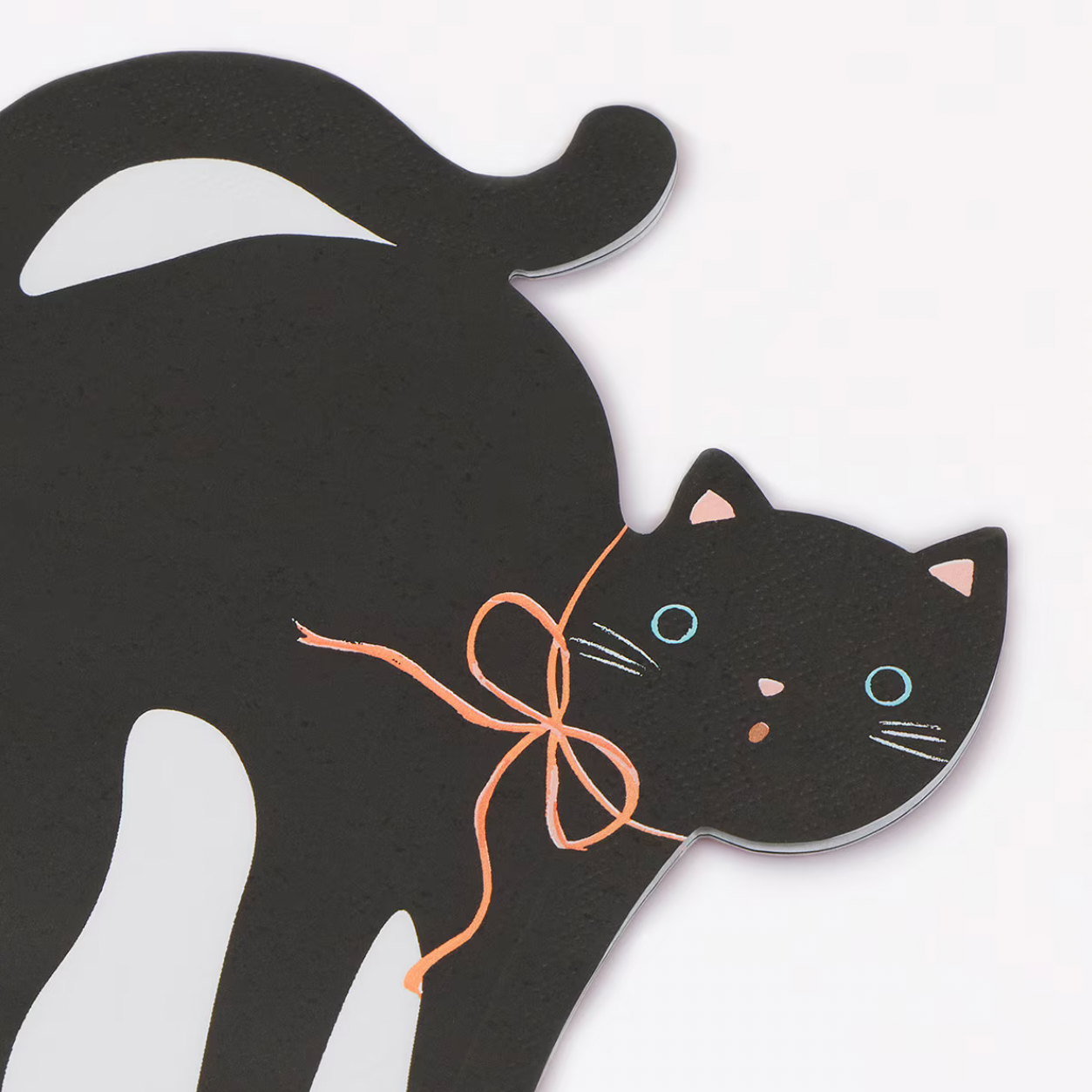 A black cat-shaped napkin with a peach ribbon bow around its neck, shown against a white background with partial product text visible on the right edge.