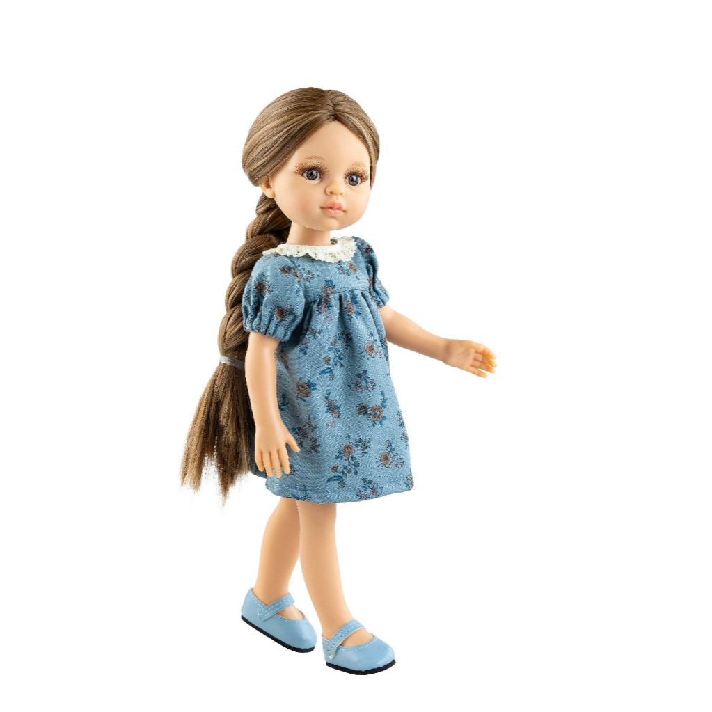 A doll with long brown hair in a side braid, wearing a light blue floral print dress and matching blue shoes, shown against a white background 