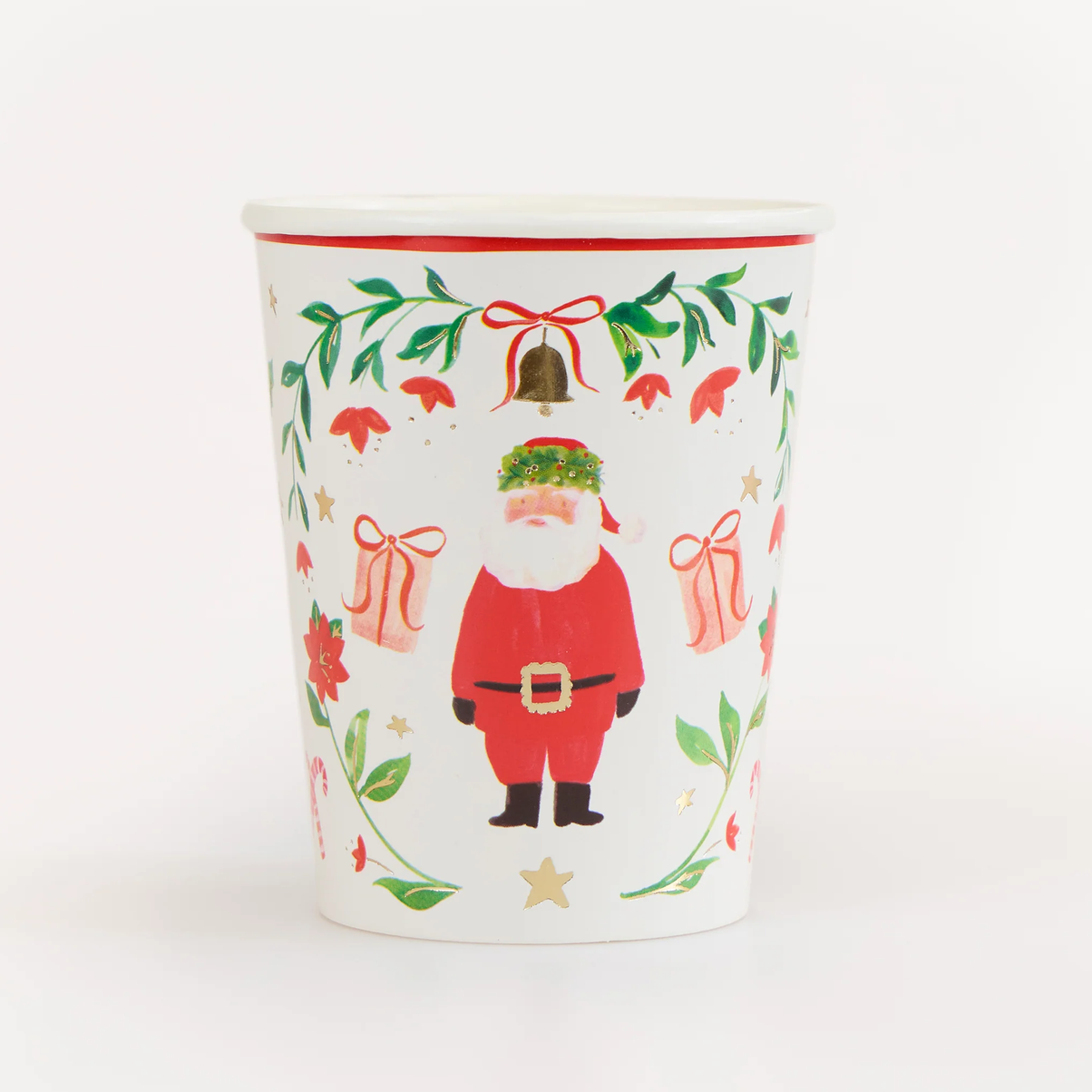 A white paper party cup decorated with a festive Christmas design featuring Santa Claus, green holly leaves, red bows, and gold stars, set against a plain white background.