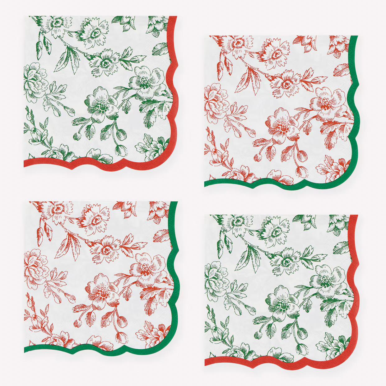 Four square napkins arranged in a 2x2 grid on a white background. Each napkin has a white base with a floral toile-style print in one of two colorways: one in green and red, and one in red and green.