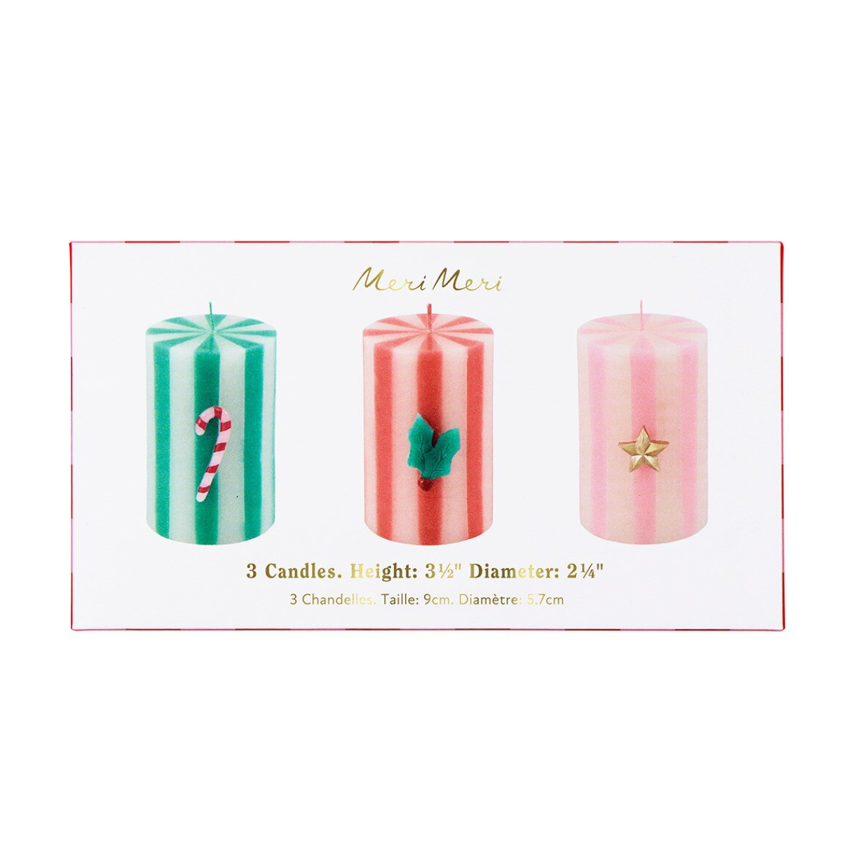 A boxed set of three mini pillar candles on a white background. The package shows three striped candles: teal and white with a candy cane motif, coral and white with a holly leaf motif, and pale pink and white with a gold star motif.