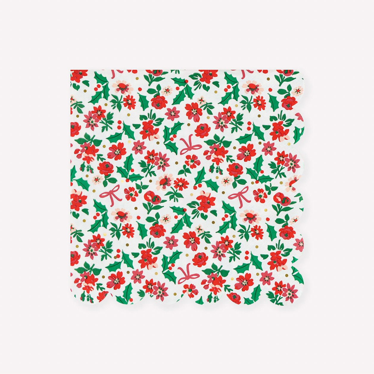 A square paper napkin with a scalloped edge, featuring a festive Christmas pattern of red poinsettias, green holly leaves, and pink bows on a white background.