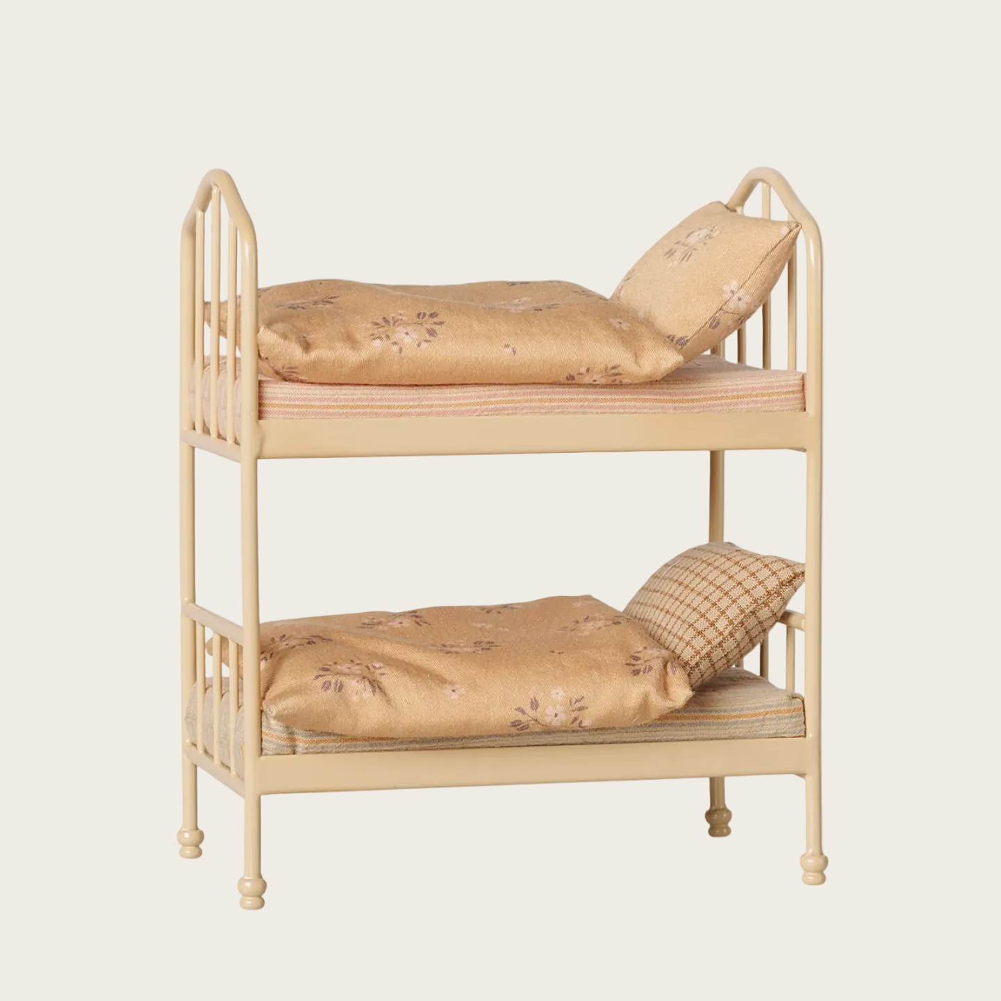 A webpage screenshot showing a wooden bunk bed with floral-patterned bedding. The product is displayed on a light beige background 