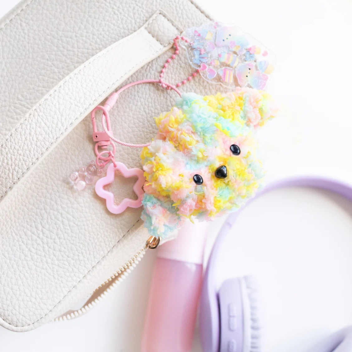 Colorful hair tie with a small plush toy on a white background